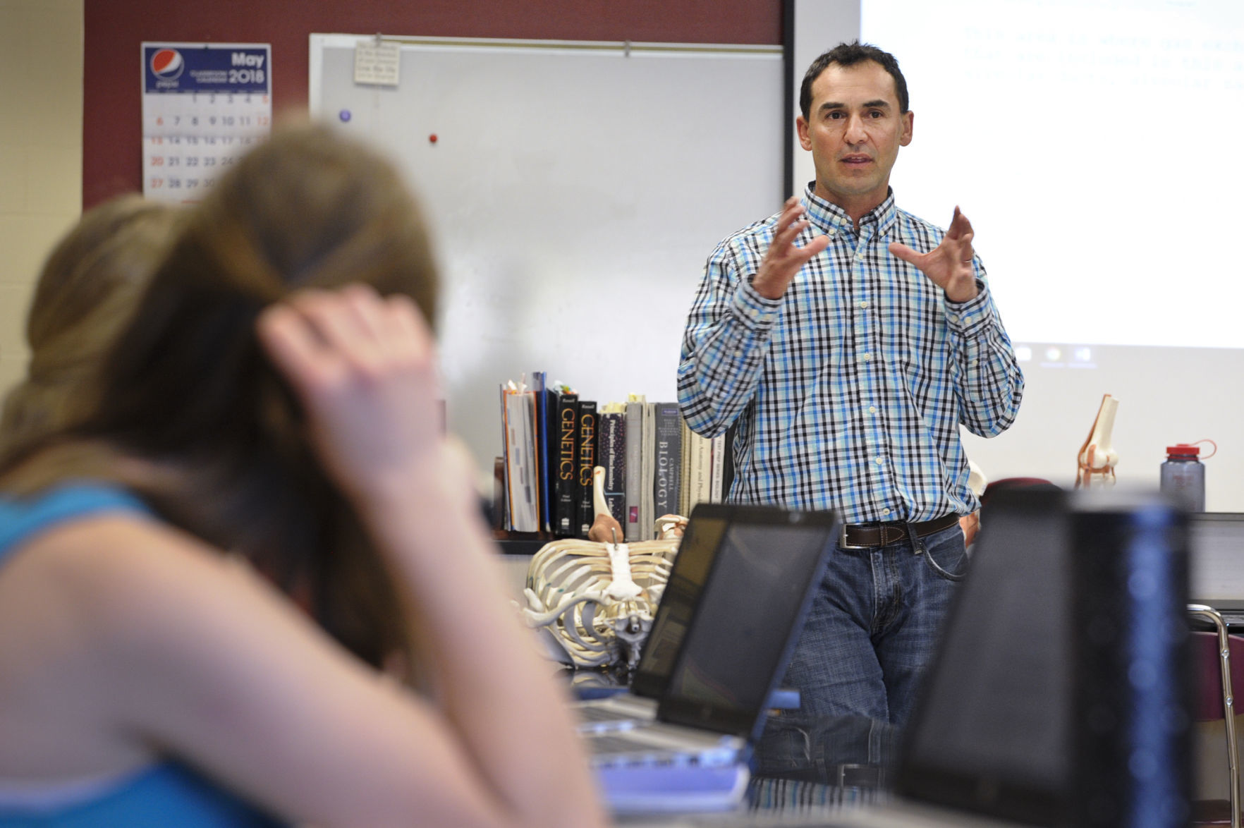Health Careers teacher Manny Garza lectures students recently at Helena High School